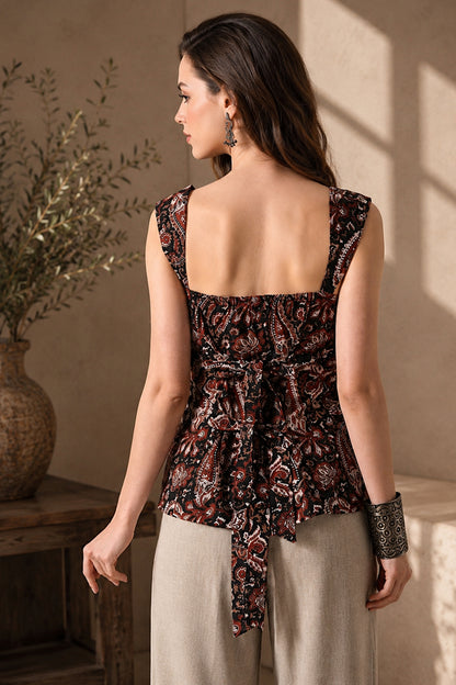 Casual Women’s Paisley Tunic Top paired with neutral trousers