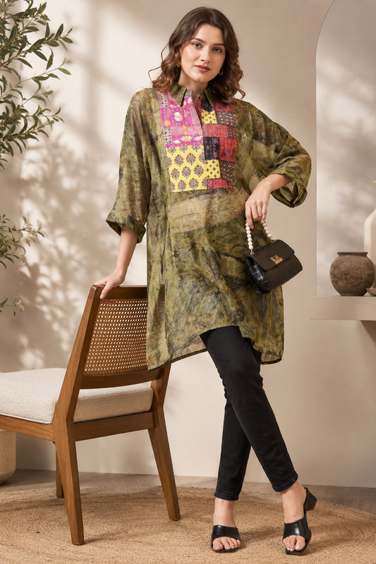 Model wearing olive green abstract printed tunic with black pants