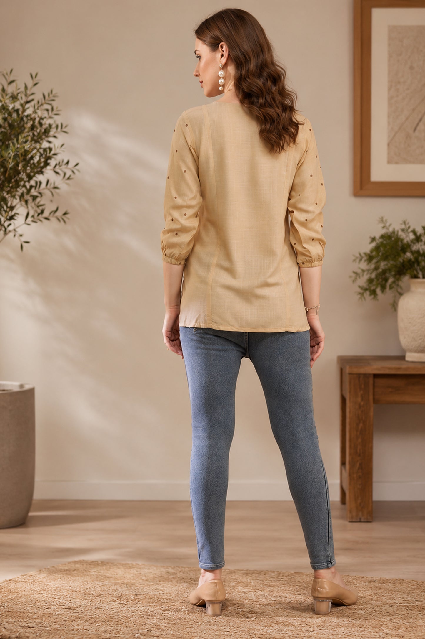 Beige tunic paired with blue denim for casual styling