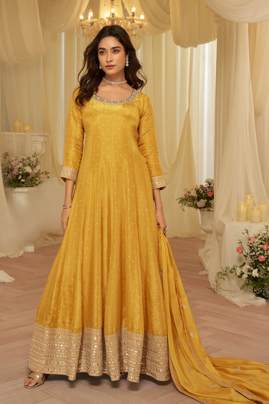 Front view of yellow anarkali suit with heavy embroidery