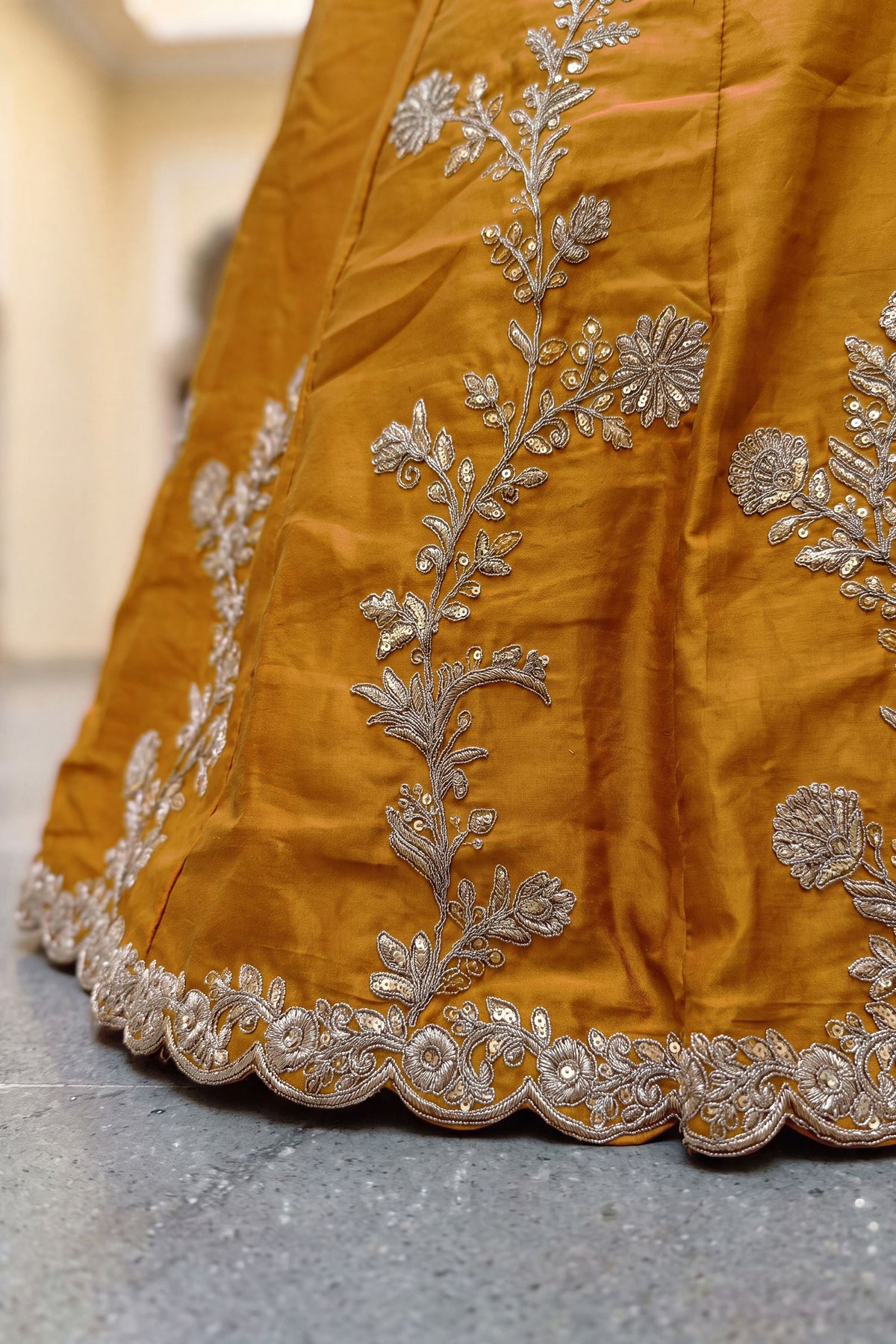 Yellow embroidered choli close-up with sequence detail