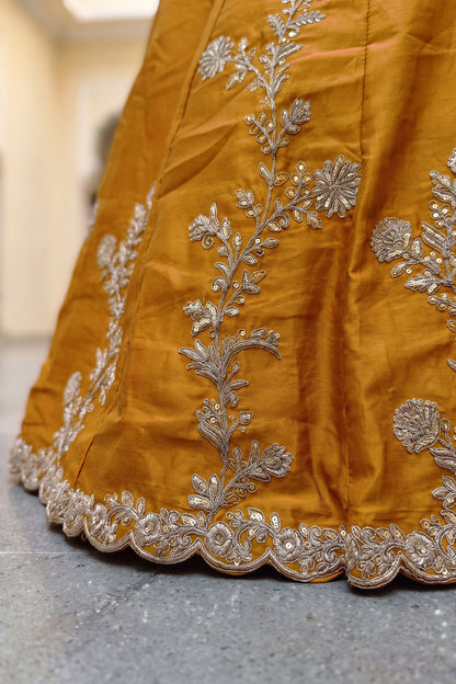 Yellow embroidered choli close-up with sequence detail