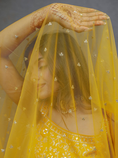 Side profile of yellow lehenga choli silhouette