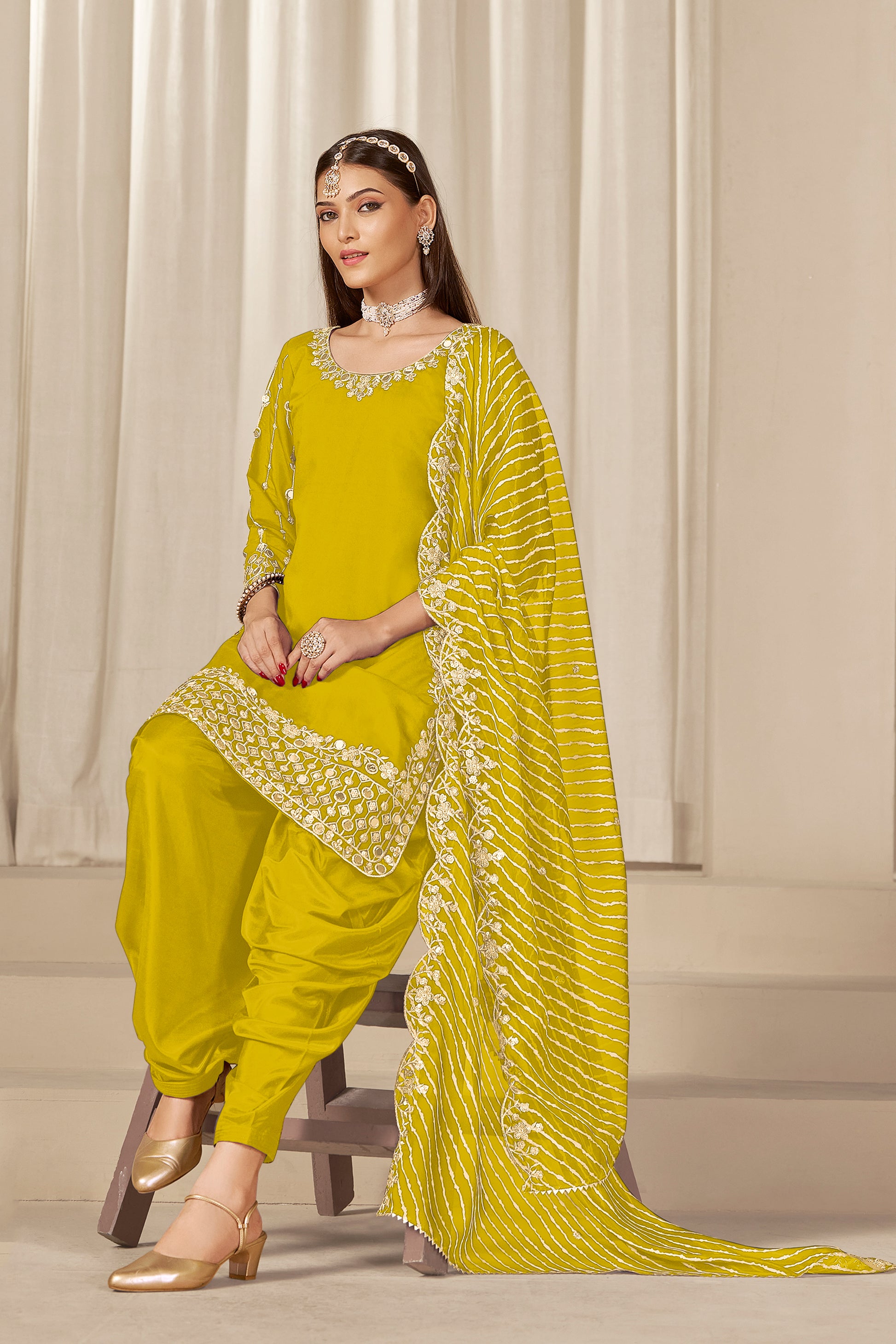 Yellow patiyala suit styled with soft organza dupatta