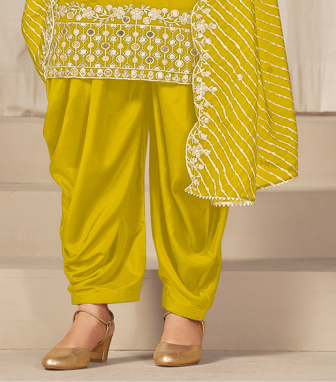 Front detail shot of mirror and embroidery work on patiyala dress