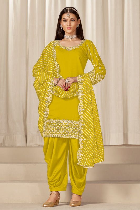 Front view of yellow patiyala suit with embroidery and mirror work
