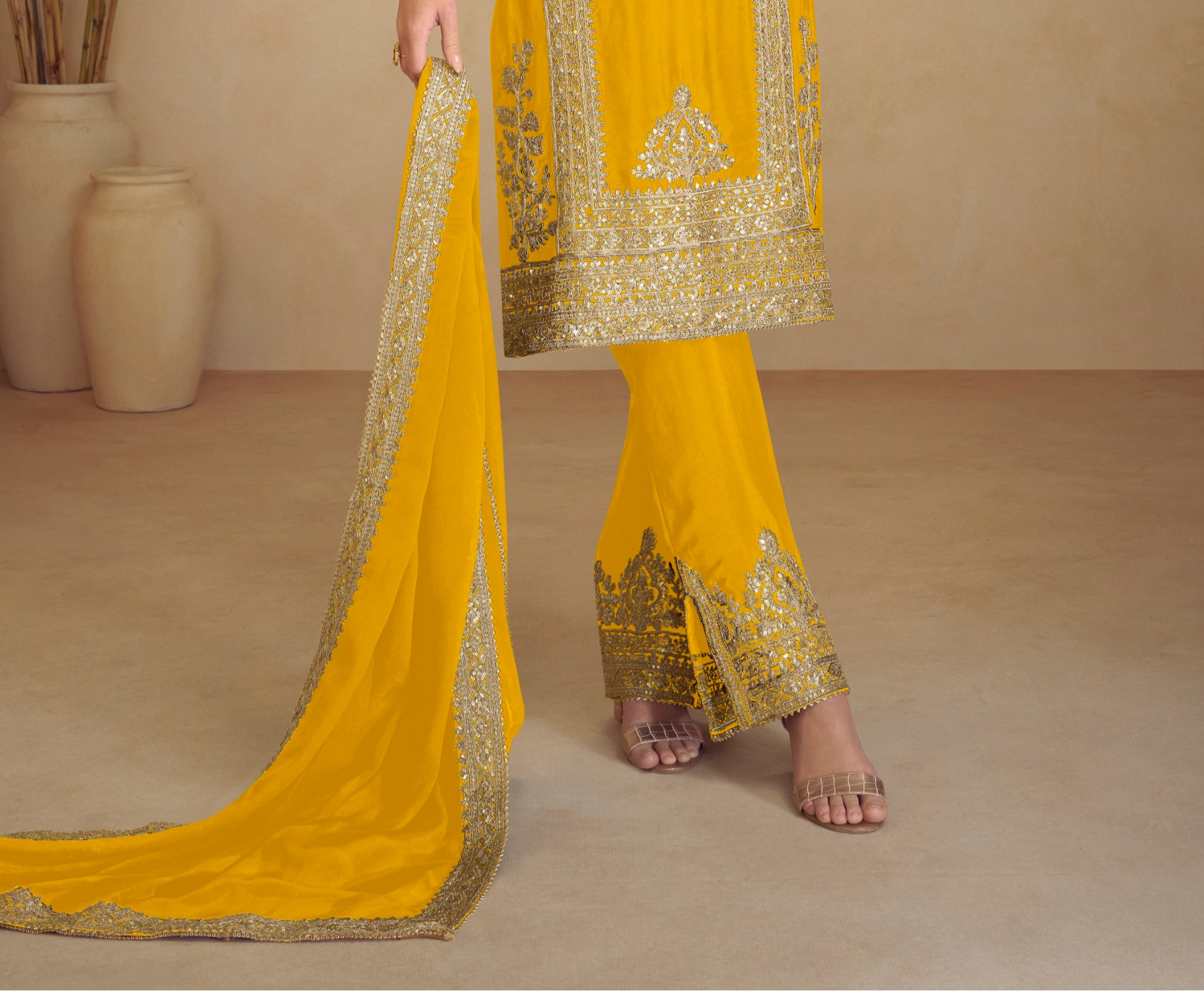 Yellow salwar kameez sleeve embroidery close up
