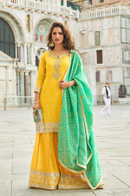 Yellow sharara salwar kameez front view with embroidery