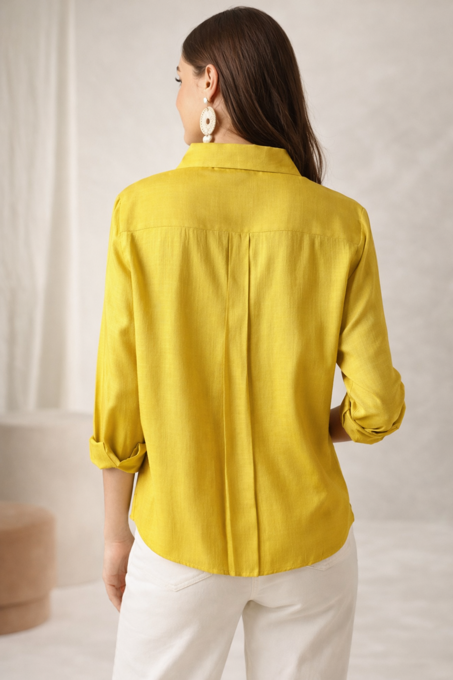 Yellow shirt styled for casual office outfit