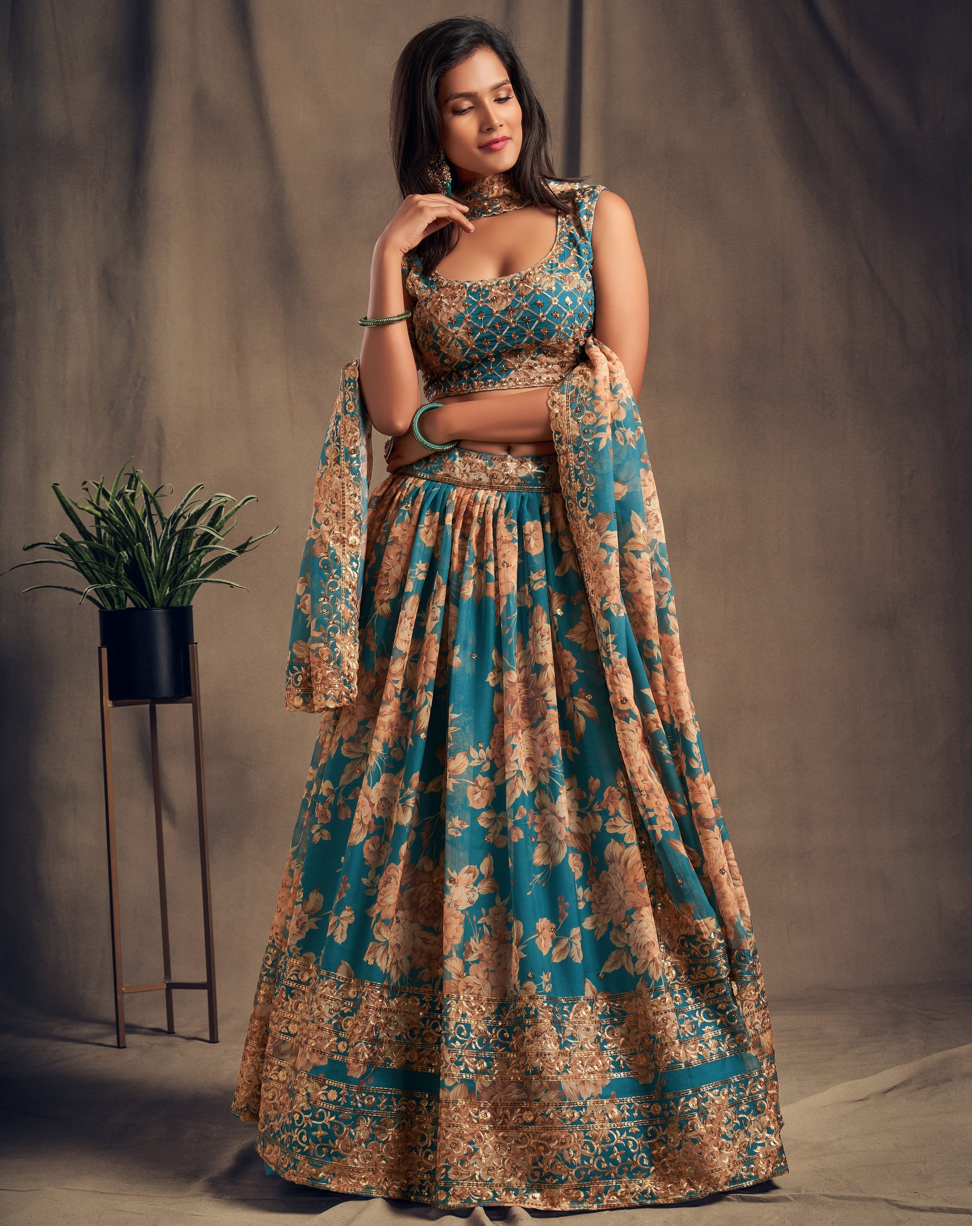 Reception-ready lehenga choli dizain in soft cyan tone