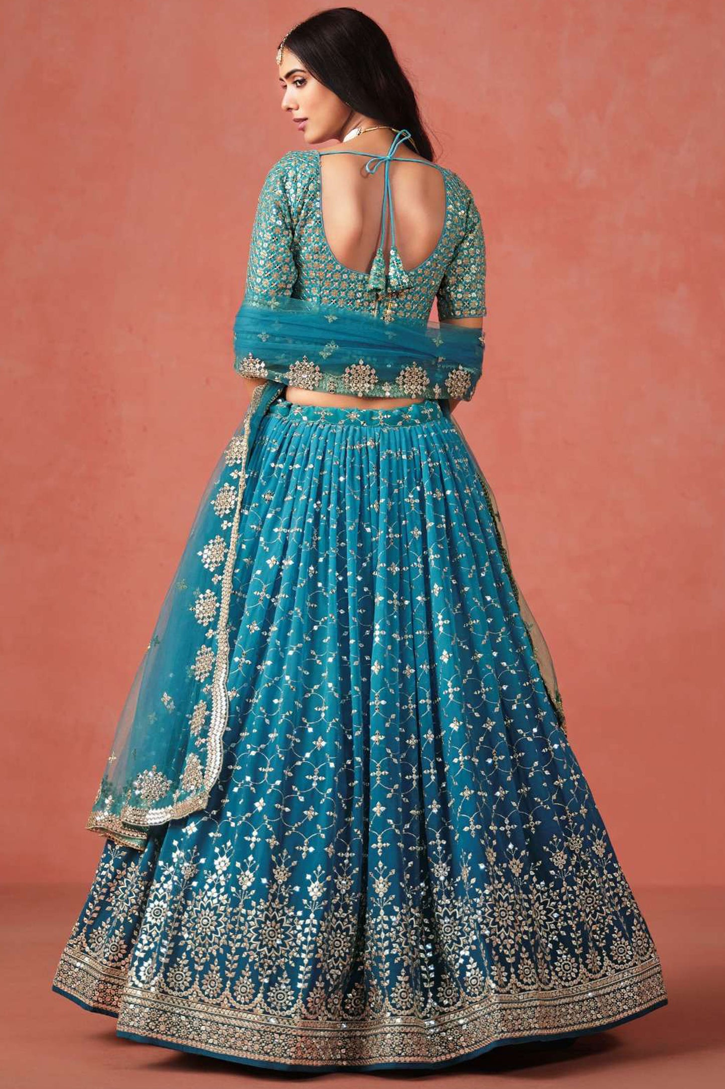 Detailed view of sequins pattern on lehenga skirt