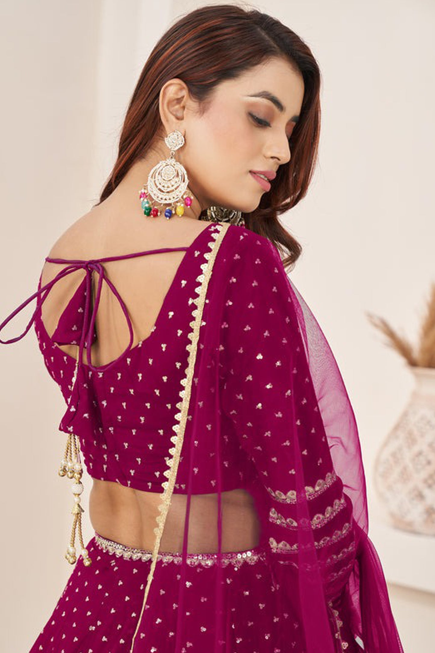 Pink lehenga choli with sequins and zari work close-up