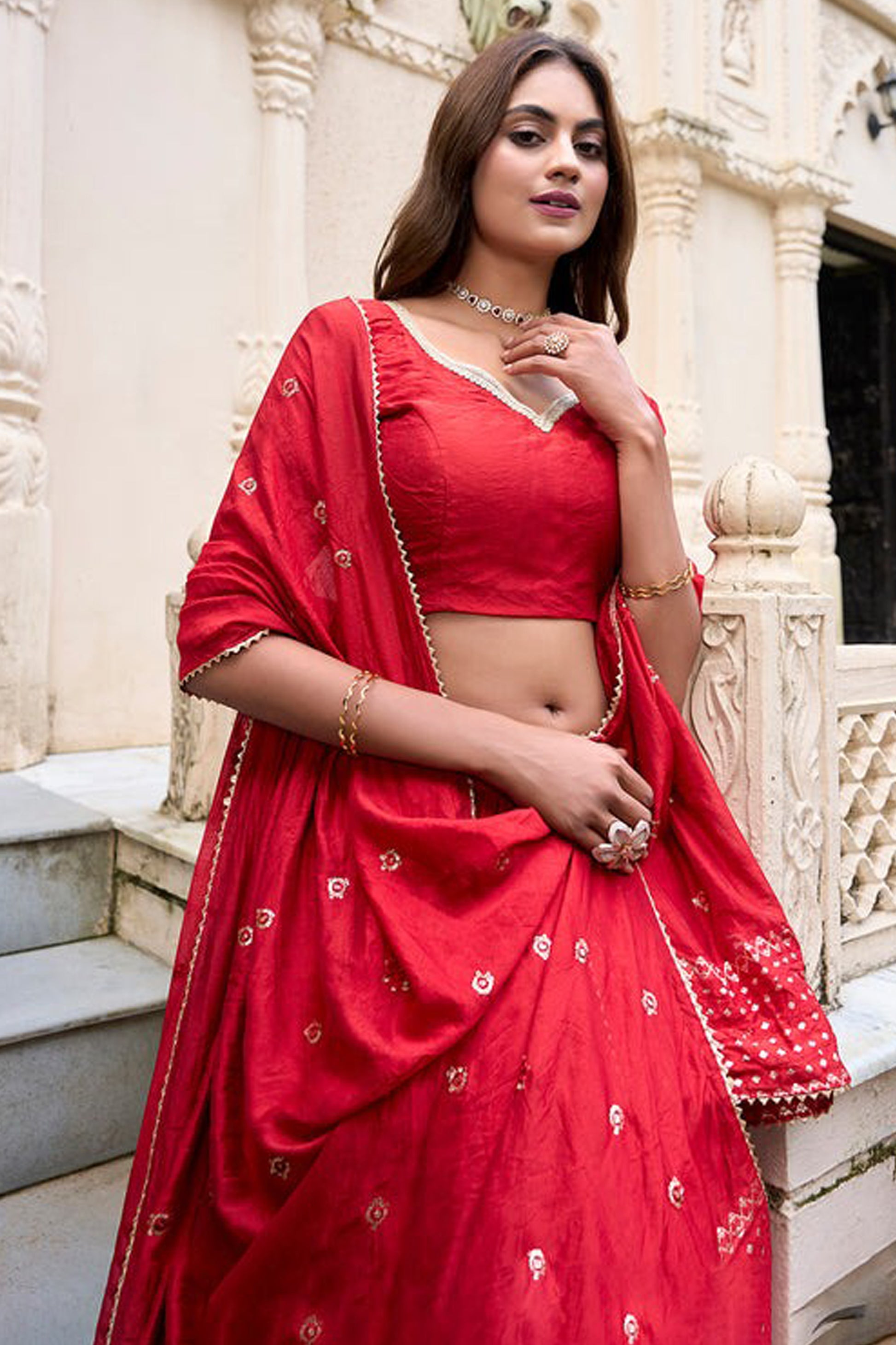 Close-up of intricate zari work on lehenga panel